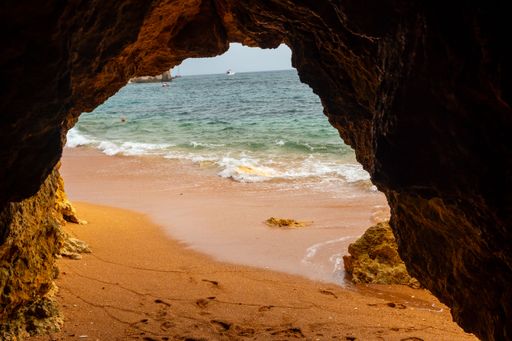 A natural cave in the Algarve on the beach at Praia da Coelha, Albufeira, Portugal