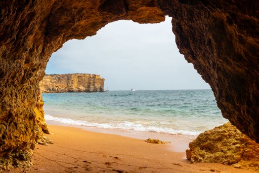 A natural cave in the Algarve on the beach at Praia da Coelha, Albufeira, Portugal