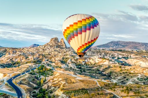 An aerial view of colorful balloon flying over Cappadocia