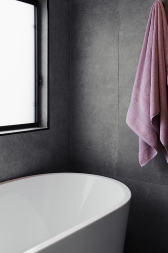 The beautiful and contemporary bathroom with a ceramic bathtub