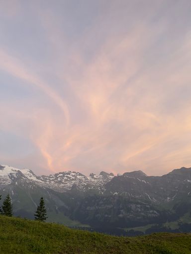 Beautiful sunset in the Swiss mountains and a pink sky with nice texture