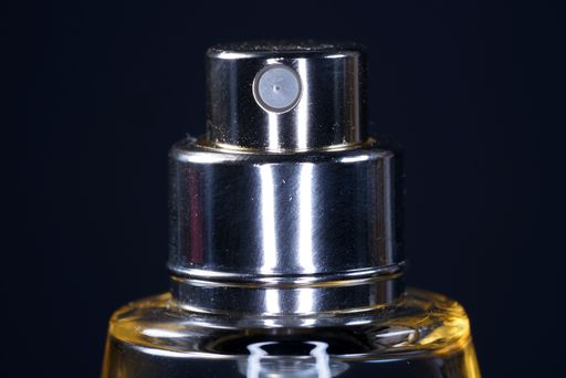A closeup shot of a perfume glass bottle