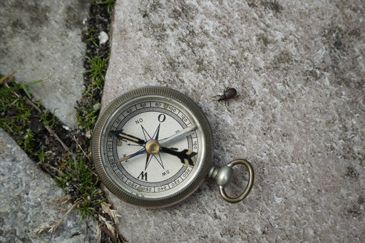 A selective focus shot of pocket old compass