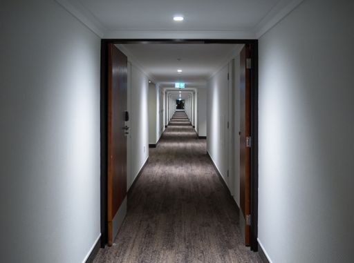 wellington, new zealand, august 8 2020. The corridor of a wellington hotel with lights casting patterns. in the distance a large picture window
