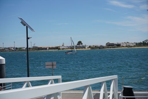 A sailboat in the blue lake during the daytime
