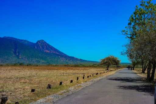 A view of empty asphalt road with a mountain background