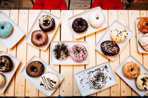 A closeup of donuts on a wooden table