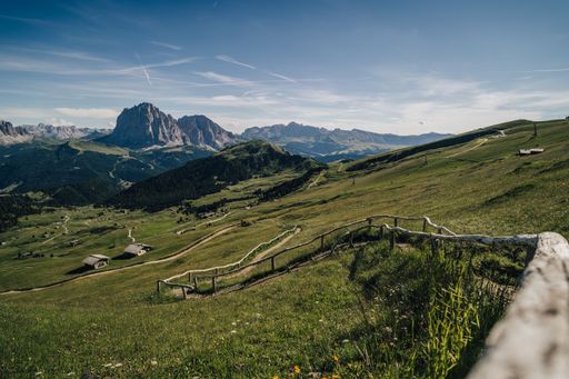 Fantastic mountain landscape of Dolomites with a hiking trail and view of Sassolungo (Langkofel) in the background. Summer landscape of Dolomiti, Tyro