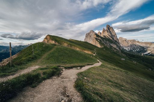 Amazing views of the Dolomites mountain landscape. Sunset view from Seceda over to the Odle mountains. Spectacular dolomitean landscape, Tyrol, Italy.