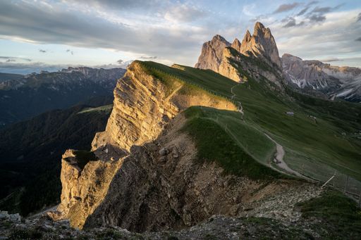 Amazing views of the Dolomites mountain landscape. Sunset view from Seceda over to the Odle mountains. Spectacular dolomitean landscape, Tyrol, Italy.