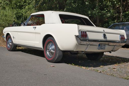 Ford Mustang cabriolet from the sixties, vintage car, diagonal rear view