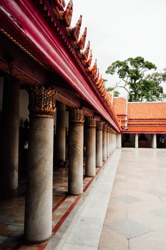 A vertical shot of Pillars in a Buddhist temple