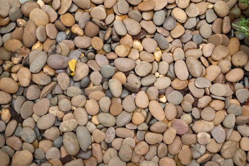 A top view of thin pebbles on a stack