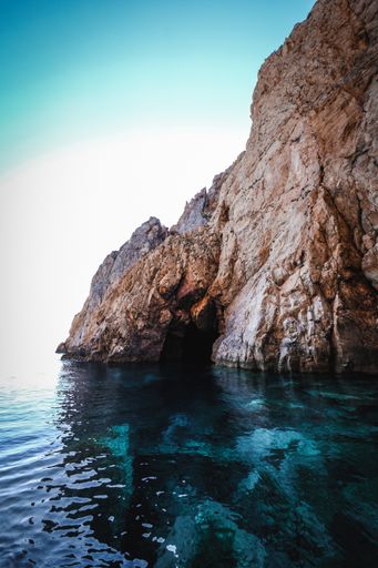 The ocean surrounded by the rocky cliffs  - great for wallpapers