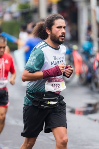 Man running the 39rd International Marathon of Mexico city on the street