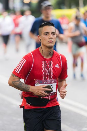 Man running the 39rd International Marathon of Mexico city on the street
