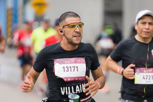 A man running the International Marathon of Mexico city on the street