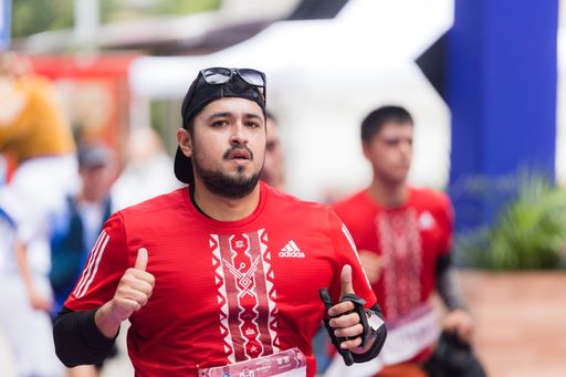 A man running the International Marathon of Mexico city on the street