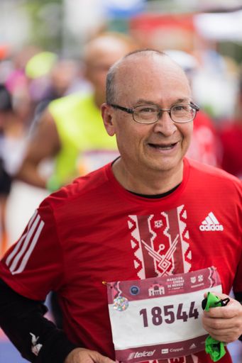 A man running the International Marathon of Mexico city on the street