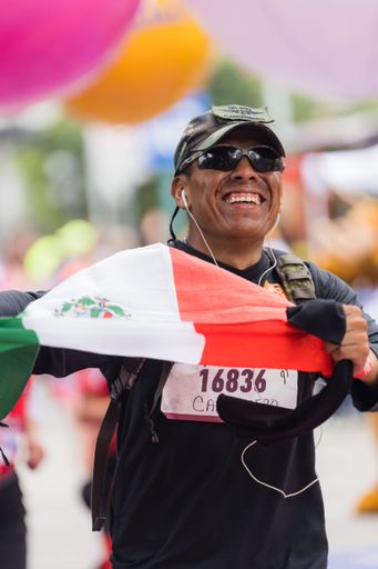 A man running the International Marathon of Mexico city on the street