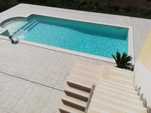 A high angle shot of a pool in a park at daytime