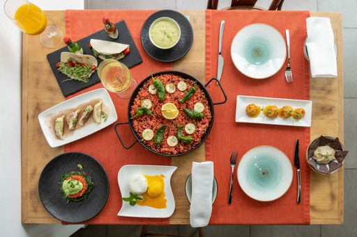 A top view of a laid table with various Spanish and Mexican cuisine dishes