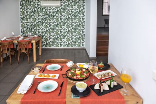 A laid table with various Spanish and Mexican cuisine dishes in the restaurant