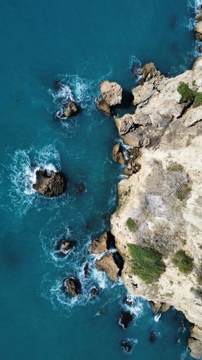 A rocky cliff overseeing the ocean view