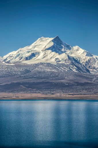 A vertical shot of the Pekucuo lake and Shishapangma snowy mountains in Xigaze, China