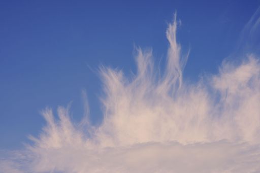 A beautiful shot of white fluffy clouds in blue sky in Toten, Norway in late summer