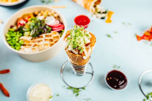 A selective focus shot of pizza cone