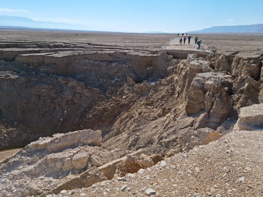 The people hiking near faults in an arid land