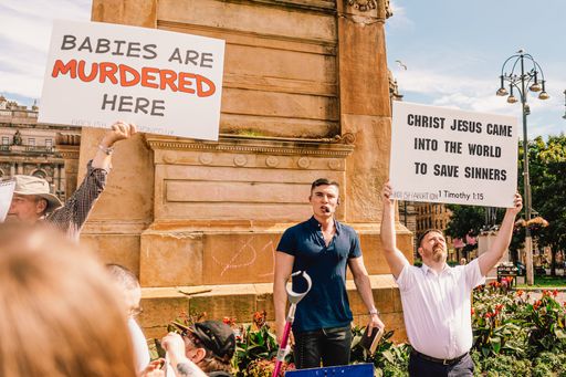 The Protesters holding signs during the abortion protest in George Square, Glasgow city center, Scotland