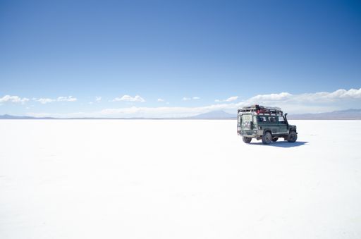 An offroad car on the snow-covered ground