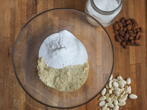 A high angle shot of a marzipan paste preparation process on a wooden table