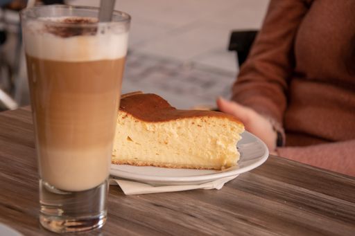 A selective focus shot of delicious cheesecake with ice coffee