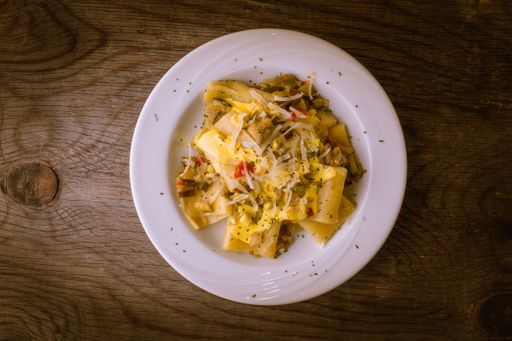 A closeup shot of pasta with zucchini sauce