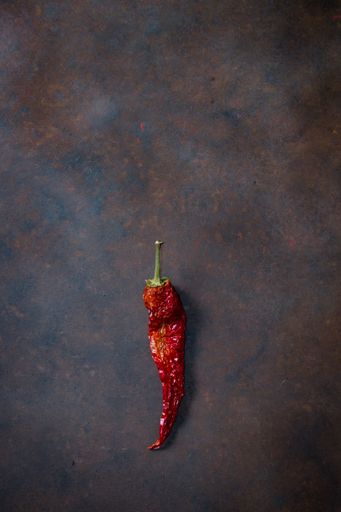 A top view of a red chili pepper