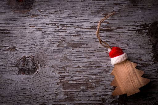 A top view of a wooden Christmas decoration placed on a wooden surface