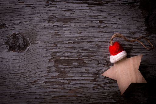 A top view of a wooden Christmas decoration placed on a wooden surface