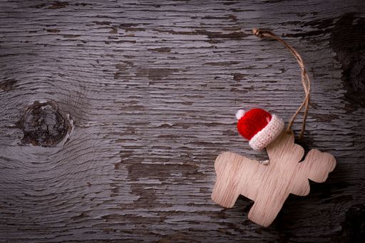 A top view of a wooden Christmas decoration placed on a wooden surface