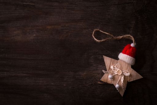 A top view of a wooden Christmas decoration placed on a wooden surface