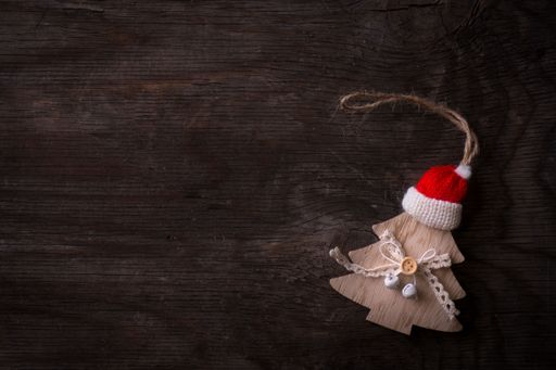 A top view of a wooden Christmas decoration placed on a wooden surface