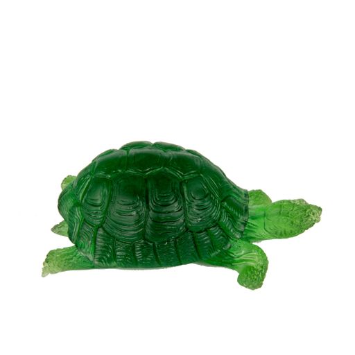 A green glass turtle on a white background - decoration for an interior