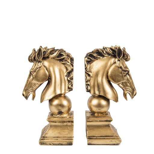 A book holder of two golden horse figures isolated on a white background - interior decoration