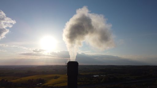 The smoke from a chemical plant and sky on the background