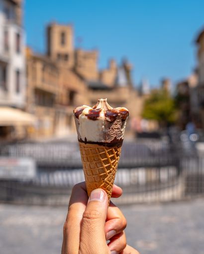A vertical shot of an ice cream cone