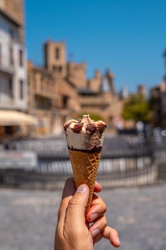 A vertical shot of an ice cream cone