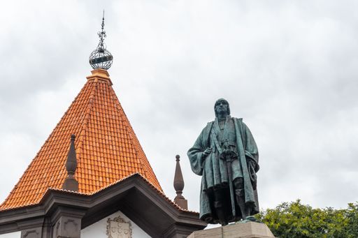 A low angle shot of a statue of Joao Goncalves Zarco in the city of Madeira, Portugal