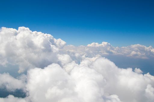 The white soft and fluffy clouds in the blue sky - dreamy background